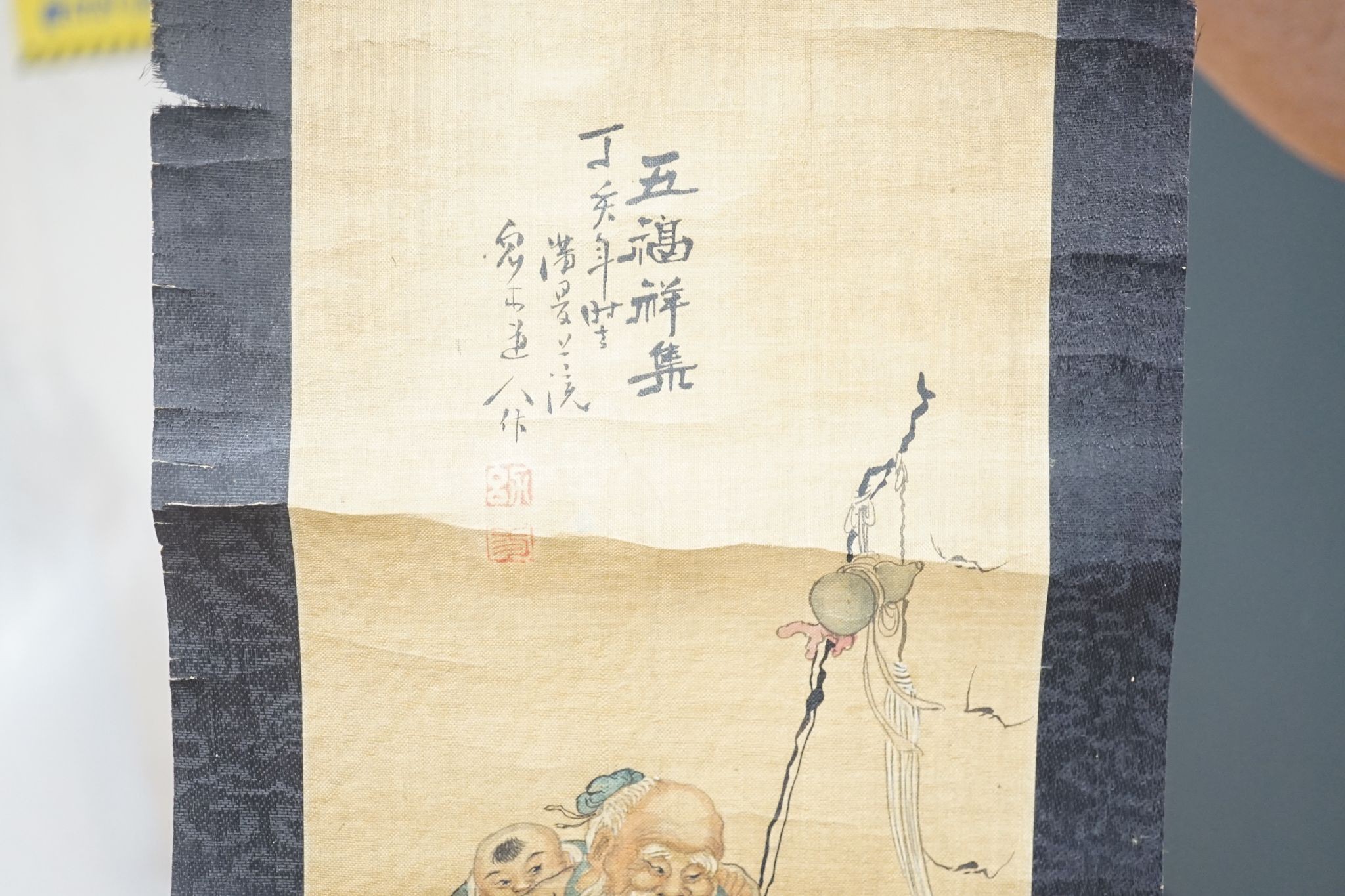 A late 19th century hand scroll and three other scroll paintings